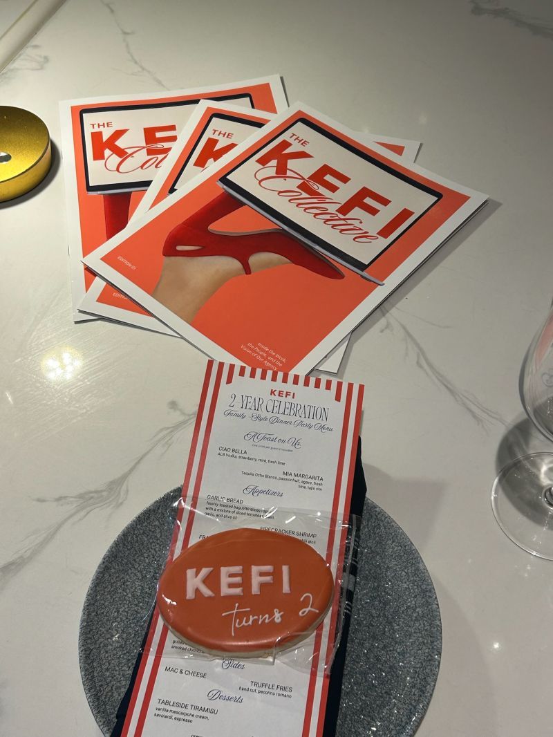 The KEFI Collective, Edition 01 — printed magazines on the launch-dinner table